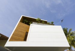 The bold exterior façade is a chiseled mass in Gauribidanur Residence ...