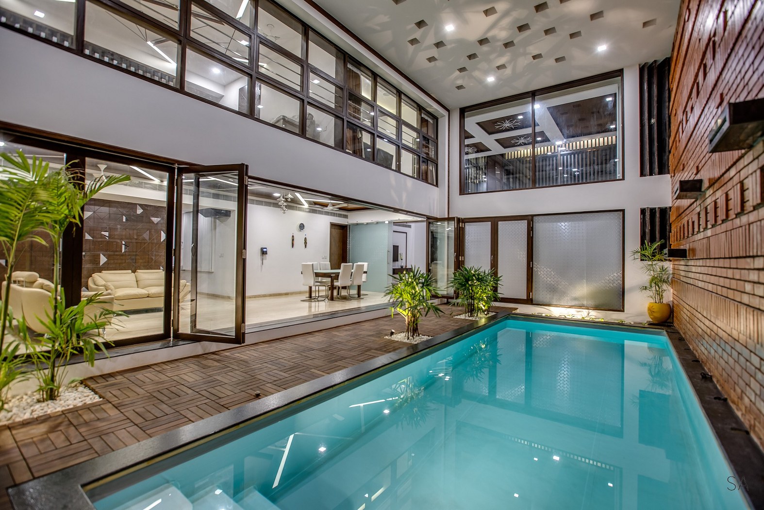 Private Residence With Indoor Pool And Brick Feature Wall At Its Heart ...