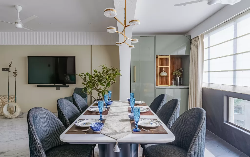 Contemporary living room with hanging light on the dining area