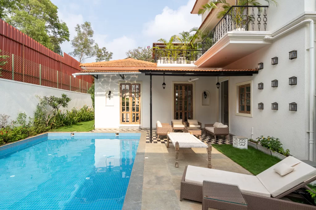 Pool side area in this Luxury Villa Design in Goa 