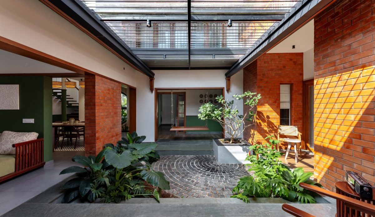This Tropical Home Design Features A Striking Sloped Terracotta Roof In ...