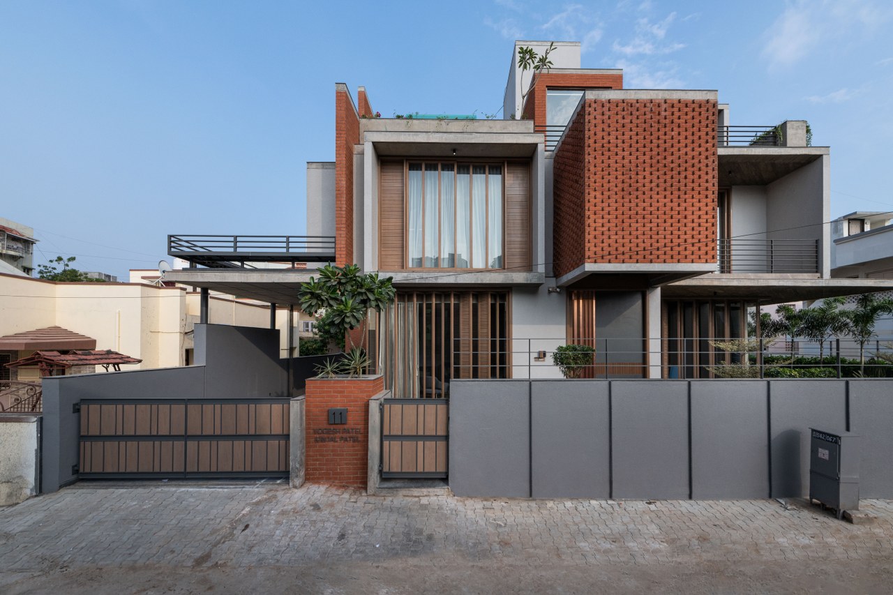 The Residence Features An Exposed Brick Design That Enhances Its Street ...